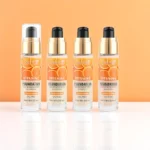 Présentoir de 12 : Base de maquillage à la vitamine C – Karité – Longue tenue